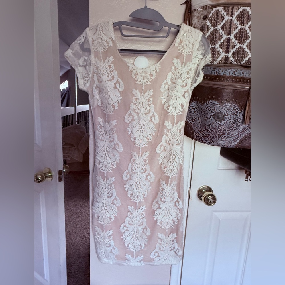 Size small white lace fitted dress with cream lining